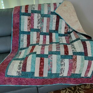 Cozy Couch, Lap, Wheelchair Throw in Teals, Burgundy and creams. 51x65 inches of warmth whenever you or a loved one need it! Easy are cotton