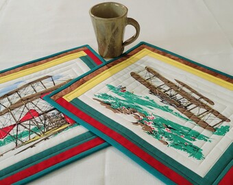 MAGNIFICENT FLYING MACHINES ! Perfect for a camper, breakfast nook, or man cave! This set of 2 placemats will add color and joy!  15x13 in