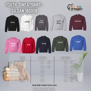 May include: A selection of youth sweatshirts in colours such as black, white, and navy. Each sweatshirt has a colour name printed on it. A size chart in centimetres is included, detailing width and length measurements.