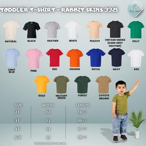 May include: A selection of toddler t-shirts in colours such as black, white, and pink. The image includes a size chart with measurements in centimetres. A young child is wearing a green t-shirt and blue jeans.