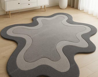 Abstrakter, gewellter grauer Wollteppich, handgefertigter, unregelmäßig getufteter Teppich, moderne minimalistische Wohnzimmerdekoration