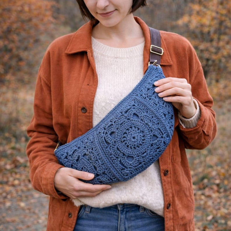 Model wearing a boho crochet crossbody bag made with paper yarn – lightweight summer sling bag with zipper closure and lining.