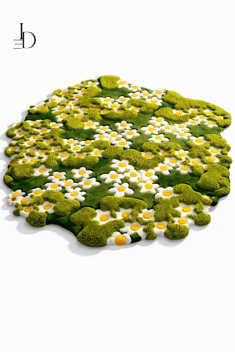 May include: A whimsical rug shaped like a field of daisies. The rug features a green base with white daisy flowers and yellow centers, surrounded by textured green patches. The design is a playful and unique home decor item.