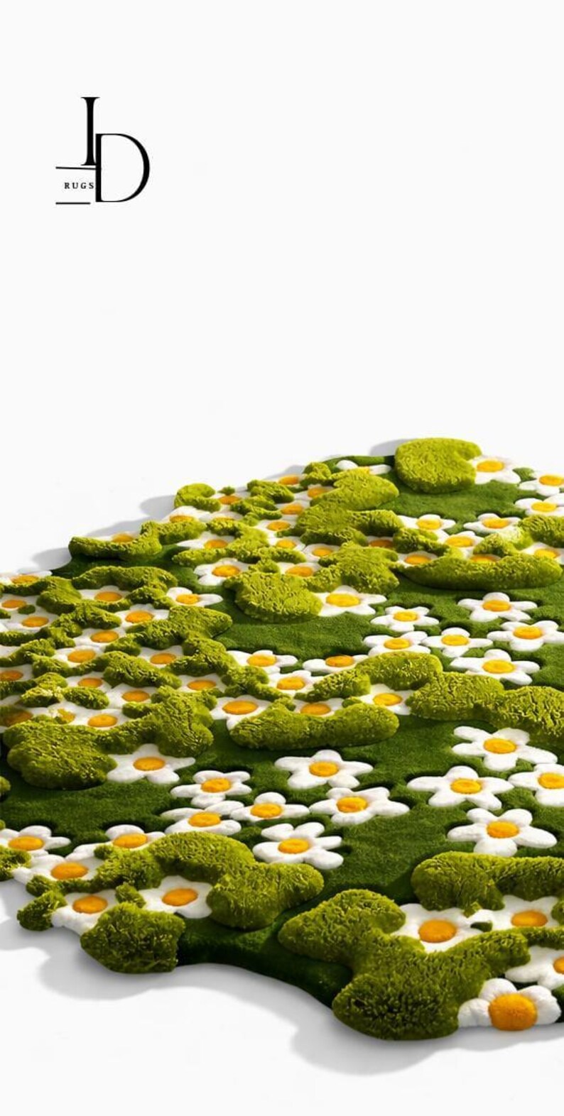 May include: A green rug with a daisy flower design. The rug features white daisy petals with yellow centers, surrounded by green moss-like tufts. The rug has a soft, textured appearance, creating a whimsical, natural aesthetic. The logo "JD RUGS" is in the top left corner.