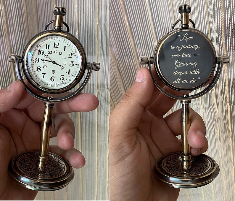 May include: A vintage-style desk clock with a round face and a decorative base. The clock face displays Roman numerals and hands. The clock is supported by a brass-colored stand. The clock's face is 3 inches in diameter.