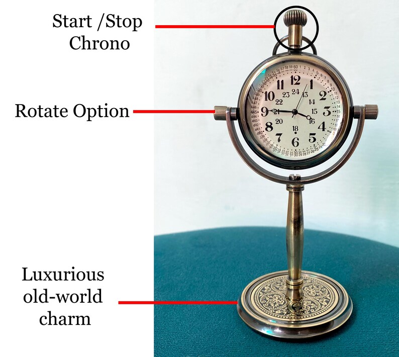 May include: A vintage-style brass clock with a round face and Roman numerals. The clock features a stand and a rotating option, with a start/stop chrono function. The base has an ornate design, and the clock evokes a luxurious, old-world charm.