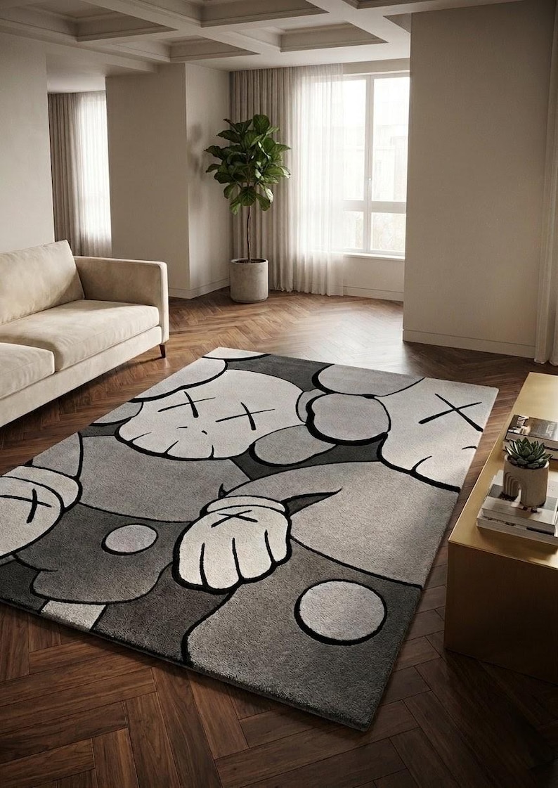 KAWS inspired hand tufted New Zealand wool rug in grey, black and ivory tones, modern pop art area rug styled in a luxury contemporary living room with designer furniture.