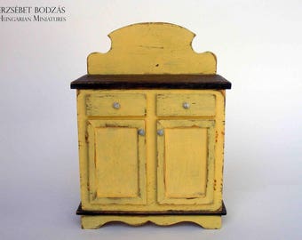 Yellow shabby sideboard