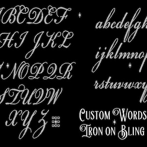 May include: A black background displays a complete alphabet in both uppercase and lowercase, crafted with a sparkling, rhinestone-like effect. The words "CUSTOM WORDS IRON ON BLING" are also featured in a decorative font.