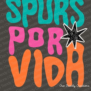 May include: A graphic design with the words "SPURS POR VIDA" in teal, pink, and orange, with a black starburst graphic. The text is in a bold, rounded font, set against a dark gray background.