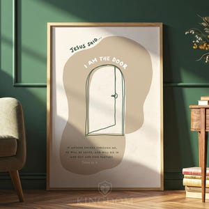 May include: A framed art print with the text "Jesus Said... I AM THE DOOR." The artwork features a minimalist line drawing of a door in a neutral colour palette. The bottom of the print includes the text "If anyone enters through me, he will be saved, and will go in and out and find pasture."
