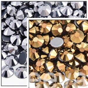May include: A collection of faceted, round, flat-backed rhinestones in two distinct color groups. The left section features metallic silver stones, while the right section displays metallic gold stones, both showing reflective surfaces.