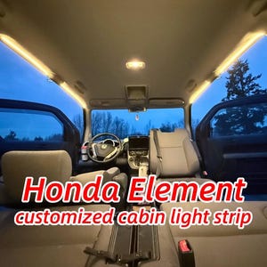 May include: Interior view of a Honda Element with customized cabin light strips. The vehicle's interior is visible, with the front seats, dashboard, and steering wheel in view. The text "Honda Element customized cabin light strip" is displayed in red and white.