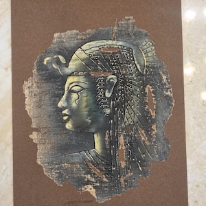 Beautiful Egyptian queen vintage artwork on authentic papyrus.