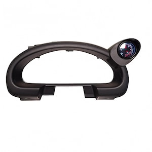 May include: A black dashboard gauge pod with a single gauge. The gauge has a black bezel, a red needle, and a white and red gauge face. The pod has a curved design with an open center.