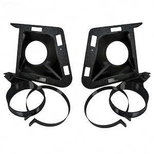 May include: Two black automotive headlight housings with circular openings and textured surfaces. Each housing has a series of rectangular cutouts and is paired with a black circular strap. The items are presented against a white background.
