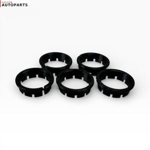 May include: Five black circular automotive clips with a notched rim design, arranged in a cluster. The text CUSTOM AUTOPARTS LLC is visible in the top left corner of the frame. These components feature a textured finish and a hollow center.