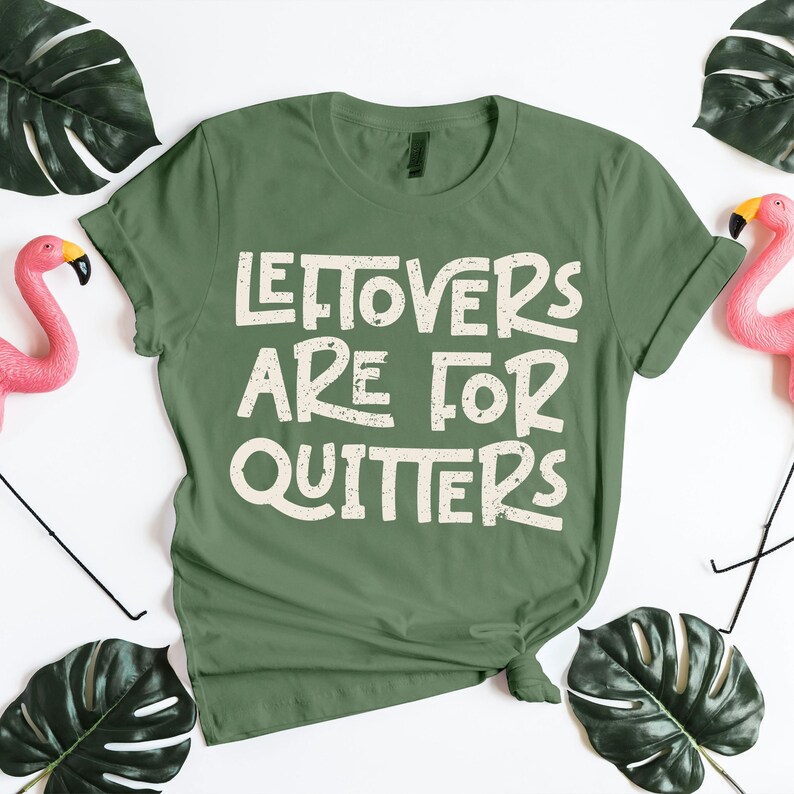 Green distressed-font tee with the phrase “Leftovers Are for Quitters.” Fun Thanksgiving graphic shirt celebrating post-dinner humor and food love. Ideal Friendsgiving outfit, fall party shirt, or casual November apparel. Great Thanksgiving PNG for Cricut and sublimation craft projects featuring funny turkey-day sayings and holiday eating jokes.