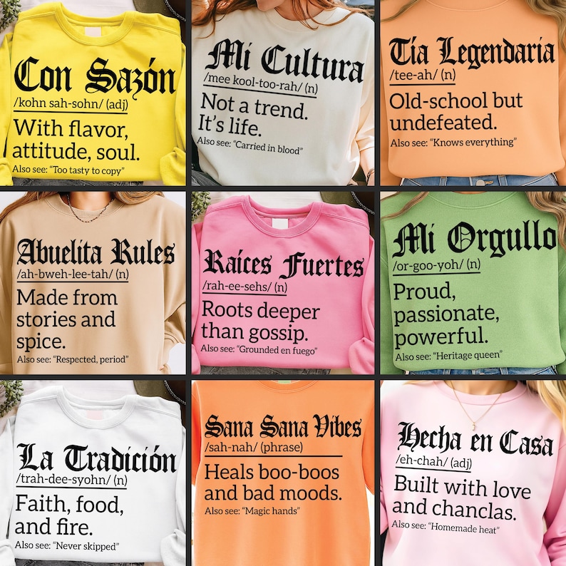 Collage of nine colorful sweatshirts and T-shirts, each featuring bold black Gothic and serif text with Spanish phrases, pronunciations, and witty definitions. Designs include: "Con Sazón" on yellow, "Mi Cultura" on cream, "Tia Legendaria" on orange, "Abuelita Rules" on beige, "Raíces Fuertes" on pink, "Mi Orgullo" on green, "La Tradición" on white, "Sana Sana Vibes" on orange, and "Hecha en Casa" on light pink.
