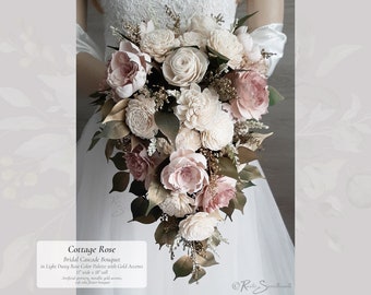 Cottage Rose Cascade Bouquet in Light Dusty Rose, Ivory, and Metallic Gold accents. Made with artificial Greenery and Soft Sola Wood Flowers