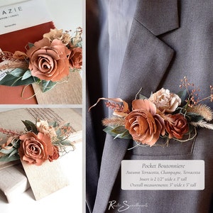 May include: A terracotta, champagne, and terracotta colored pocket boutonniere with three roses, greenery, and dried grasses. The insert is 2 1/2 inches wide by 3 inches tall. The overall measurements are 5 inches wide by 5 inches tall.
