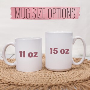 May include: Two white ceramic mugs, one labeled "11 oz" and the other "15 oz", are displayed against a neutral background. The text "MUG SIZE OPTIONS" is above the mugs. The mugs are on a woven surface.