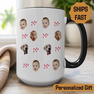 May include: White ceramic mug with a black handle and rim, decorated with baby faces, dog faces, and red heart shapes. The mug has the text "Personalized Gift" and "Ships Fast" on it.