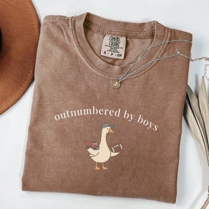 Outnumbered By Boys Shirt, Funny Boy Mom Tee, Goose with Truck and Football Graphic, Motherhood Humor Gift, Mom Life
Outnumbered by boys