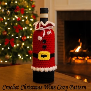 May include: A red crocheted wine bottle cosy resembling Santa Claus, featuring black buttons, a yellow belt buckle, and white trim. The cosy is on a wine bottle, with the text "CROCHET PATTERN" and "Crochet Christmas Wine Cozy Pattern".