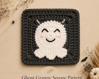 May include: A dark charcoal gray crochet granny square featuring a central white ghost motif with black embroidered eyes and mouth, and small pink stitched cheeks. The text below reads Ghost Granny Square Pattern by Mama And Stitches.