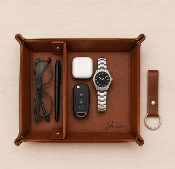 Genuinely handcrafted leather catchall tray with custom engraving — the kind of desk/bedside piece that looks expensive and feels personal.