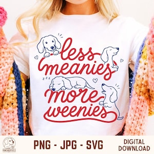 Peut inclure: T-shirt blanc avec l'inscription "less meanies more weenies" en rouge, accompagnée de dessins de teckels. Le t-shirt affiche également le texte "PNG - JPG - SVG" et "DIGITAL DOWNLOAD".