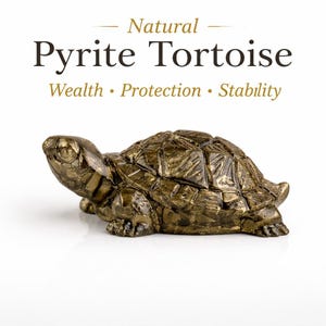 May include: A gold and brown pyrite tortoise figurine. The tortoise has a textured shell and is set against a white background. The text above reads "Natural Pyrite Tortoise" with "Wealth, Protection, Stability" below.