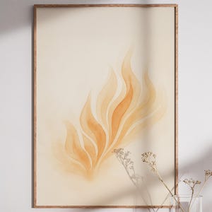 May include: A framed art print featuring an abstract watercolor design. The artwork showcases flowing, flame-like shapes in shades of orange and beige. The print is set in a wooden frame, creating a warm and inviting aesthetic.