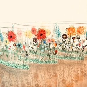 May include: A set of five glass panels with a wavy design, each featuring a colorful floral pattern with red, orange, yellow, blue, and green flowers. The panels are arranged in a row, creating a continuous floral design.