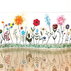 May include: A glass art piece depicting a colorful garden with flowers, leaves, and stems. The flowers are made of glass beads and the stems are made of black wire. The garden is set against a white background and is reflected in a mirror-like surface below.