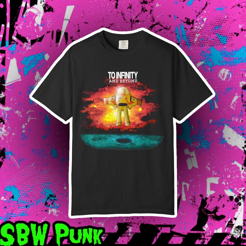 May include: A black short-sleeve t-shirt featuring a graphic of a space ranger character standing in front of a bright orange and yellow nebula. The text "TO INFINITY AND BEYOND" is printed in white above the character, with a dark blue lunar surface below.