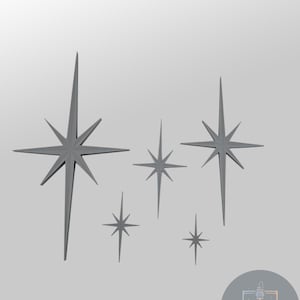 May include: A collection of gray starburst wall decor in various sizes. The starbursts have pointed rays extending from a central point, creating a mid-century modern aesthetic. The image is set against a neutral background.