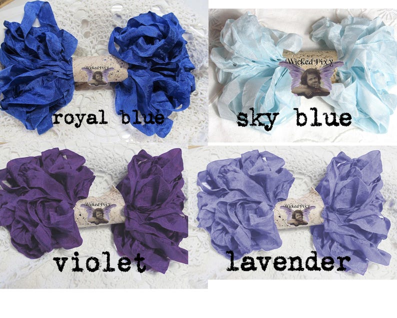 May include: Four bundles of fabric ribbon in royal blue, sky blue, violet, and lavender. Each bundle is tied with a decorative tag that reads "Wicked Pixy". The text "royal blue", "sky blue", "violet", and "lavender" are printed below each bundle.