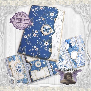 Carpeta de recortes efímera con tapa abatible, diseño floral azul y marfil, inserto de diario con mariposas y bolsillos tipo acordeón.