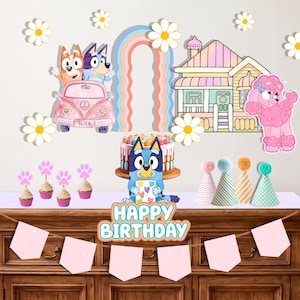 May include: A Bluey-themed party decoration set featuring wall decals of characters in a pink car, a house, a rainbow, and daisies. Includes a Happy Birthday sign, a cake topper, four party hats, and pink paw print cupcake toppers.
