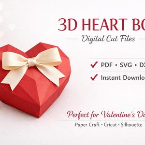 Pode incluir: Uma caixa vermelha em forma de coração 3D com um laço creme. A caixa é feita de papel e tem um design geométrico. O texto na imagem diz "3D HEART BOX - Digital Cut Files" e "PDF, SVG, DXF, Instant Download".