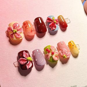 May include: A set of three ceramic mugs with a speckled, matte finish. The mugs are in shades of cream, light gray, and dark gray. Each mug has a simple, modern design and a rounded handle. Perfect for coffee or tea.