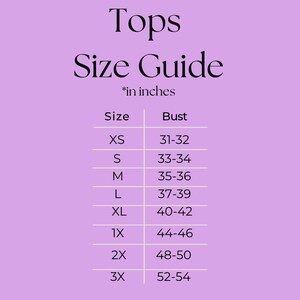 May include: A size guide for tops, with bust measurements in inches. The guide includes sizes XS to 3X, with corresponding bust measurements ranging from 78.7-81.3 cm to 132.1-137.2 cm. The text "Tops Size Guide" is at the top.