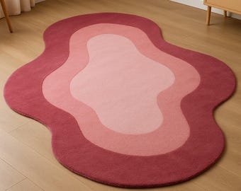 Alfombra de lana tejida a mano: diseño de ondas abstractas en rosa ruborizado