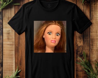Shocked Barbie Doll Face T-Shirt | Funny Meme Reaction Graphic Tee | “Disgusted / Confused” Doll Expression Shirt black