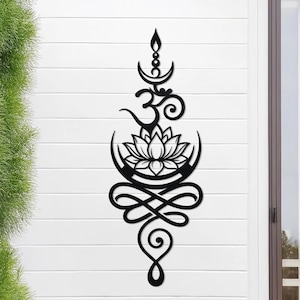 May include: Black metal wall art featuring a lotus flower, the Om symbol, and other spiritual elements. The design includes a crescent moon shape and a decorative swirl at the bottom. The artwork is mounted on a white, horizontal-planked wall.