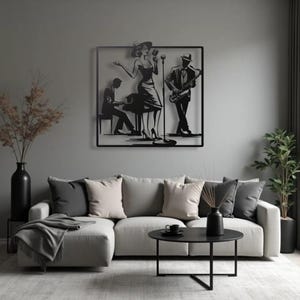 May include: Black metal wall art depicting a jazz band. The artwork features a singer, a saxophone player, and a pianist. The figures are silhouetted against a square frame, creating a stylish and artistic representation of a musical performance.