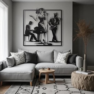 May include: A black metal wall art piece depicting a jazz band. The artwork features a singer, a pianist, and a saxophonist. The figures are set against a square frame, creating a silhouette effect. The art is mounted above a gray sectional sofa.
