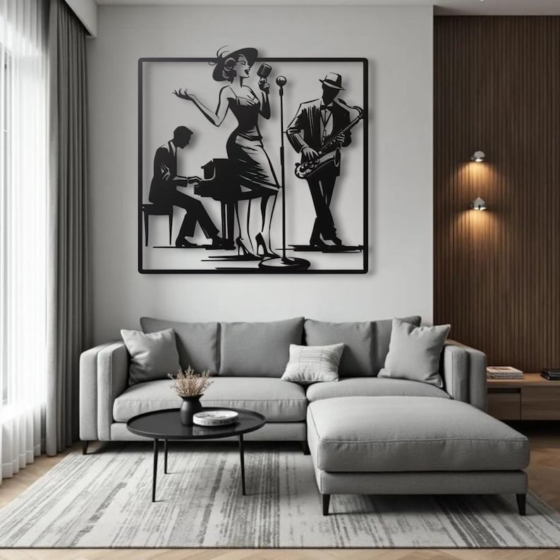 May include: Black metal wall art depicting a jazz band. The artwork features a singer, a pianist, and a saxophone player. The figures are silhouetted against a white background, framed in a black square. The art hangs above a gray sectional sofa.